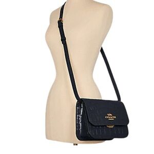 Coach 

BRYNN FLAP CROSSBODY $300